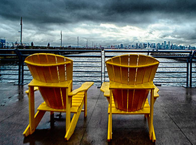 two chairs on a waterfront deck