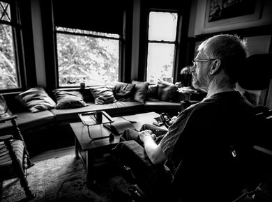 black and white photo of Ted Stehr in his living room